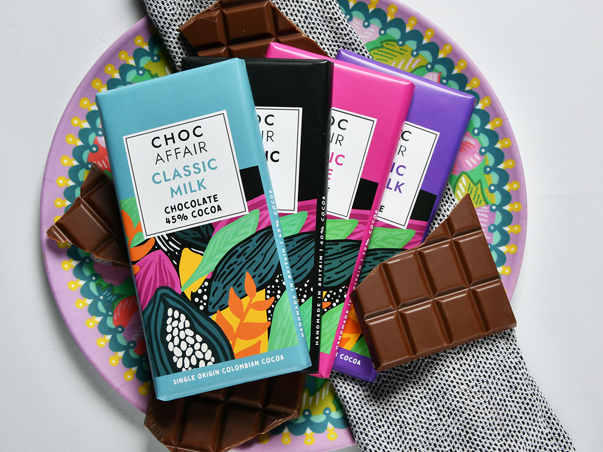 4 chocolate bars on patterned background.